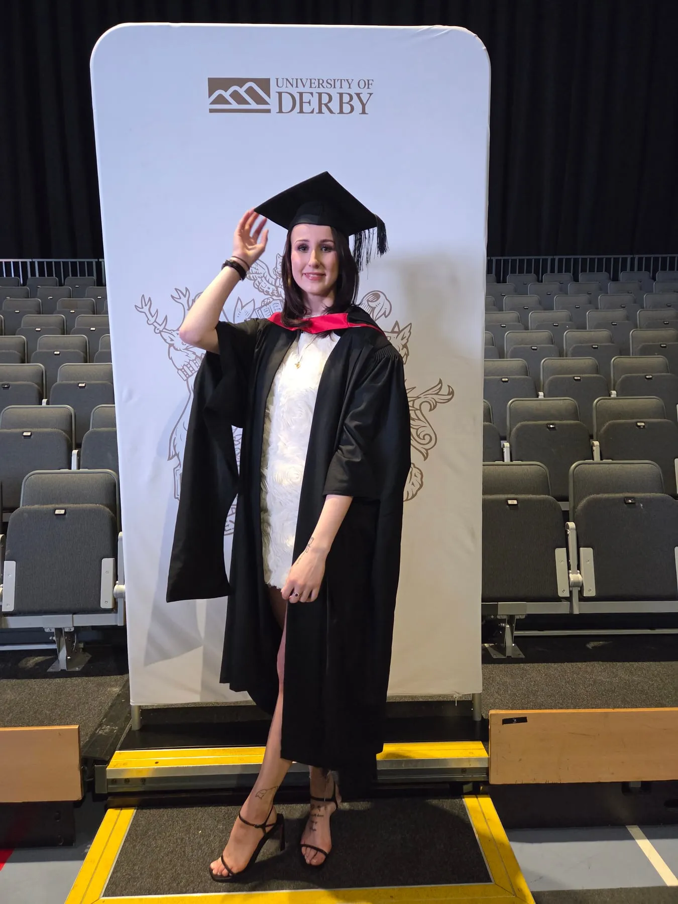 Emma in graduation cap and gown